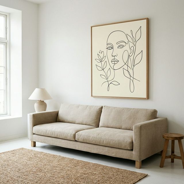 Tranh line art tối giản vẽ gương mặt trên nền ngà trong phòng khách Scandinavian